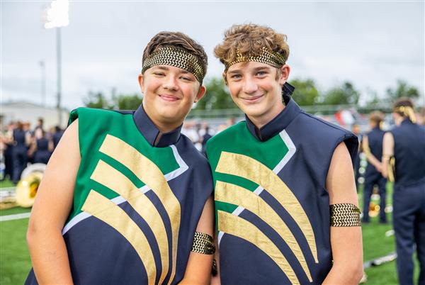 Two IHS band members smile